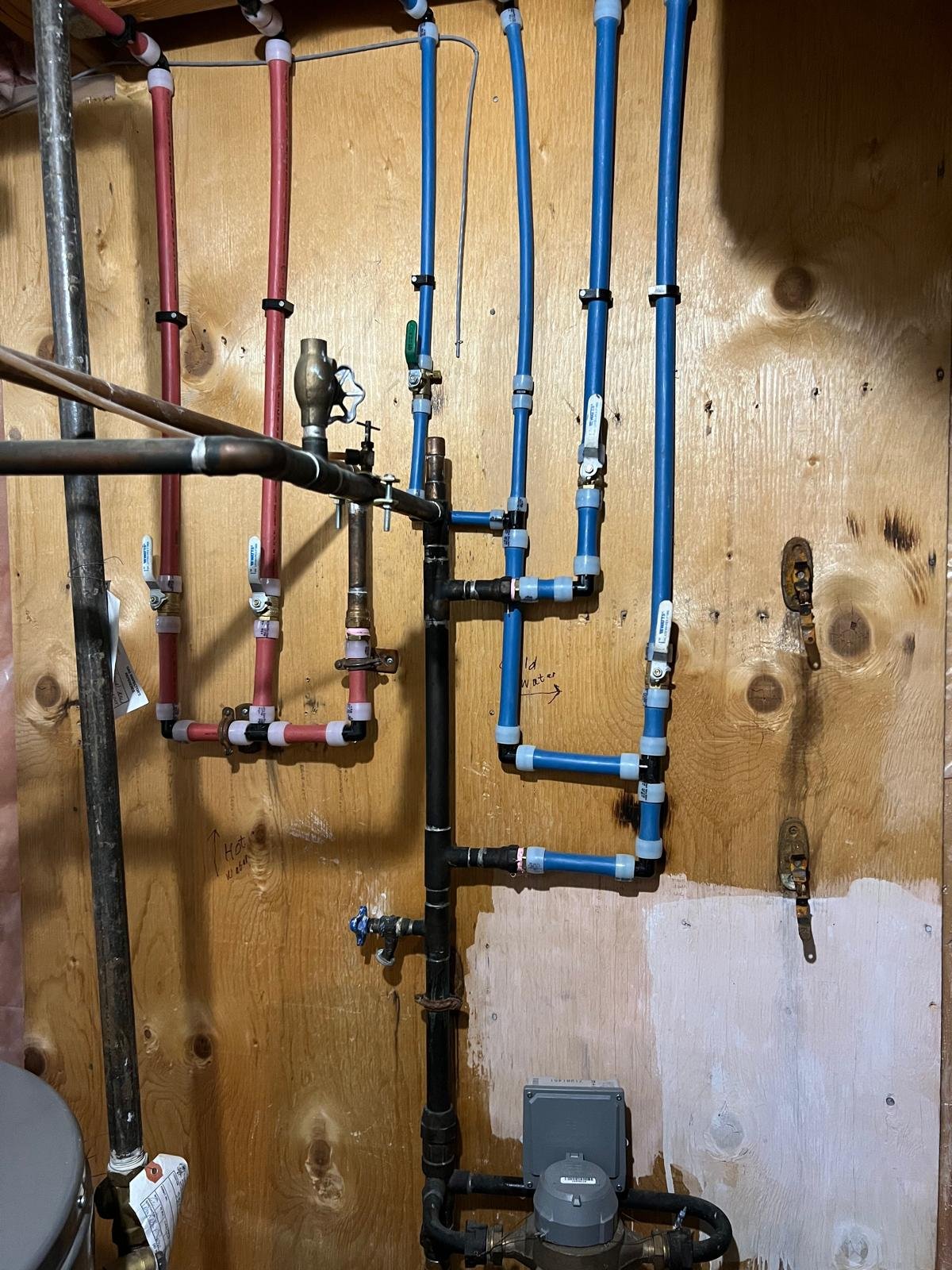 Clean, professionally installed modern PEX piping Old Poly-B pipes